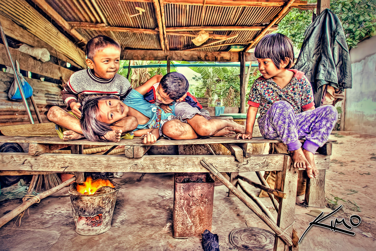 Kids Huddling Over Fire, Cold Day in Thailand