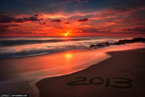 Sunrise at Coral Cove Park with 2013 Written on Beach