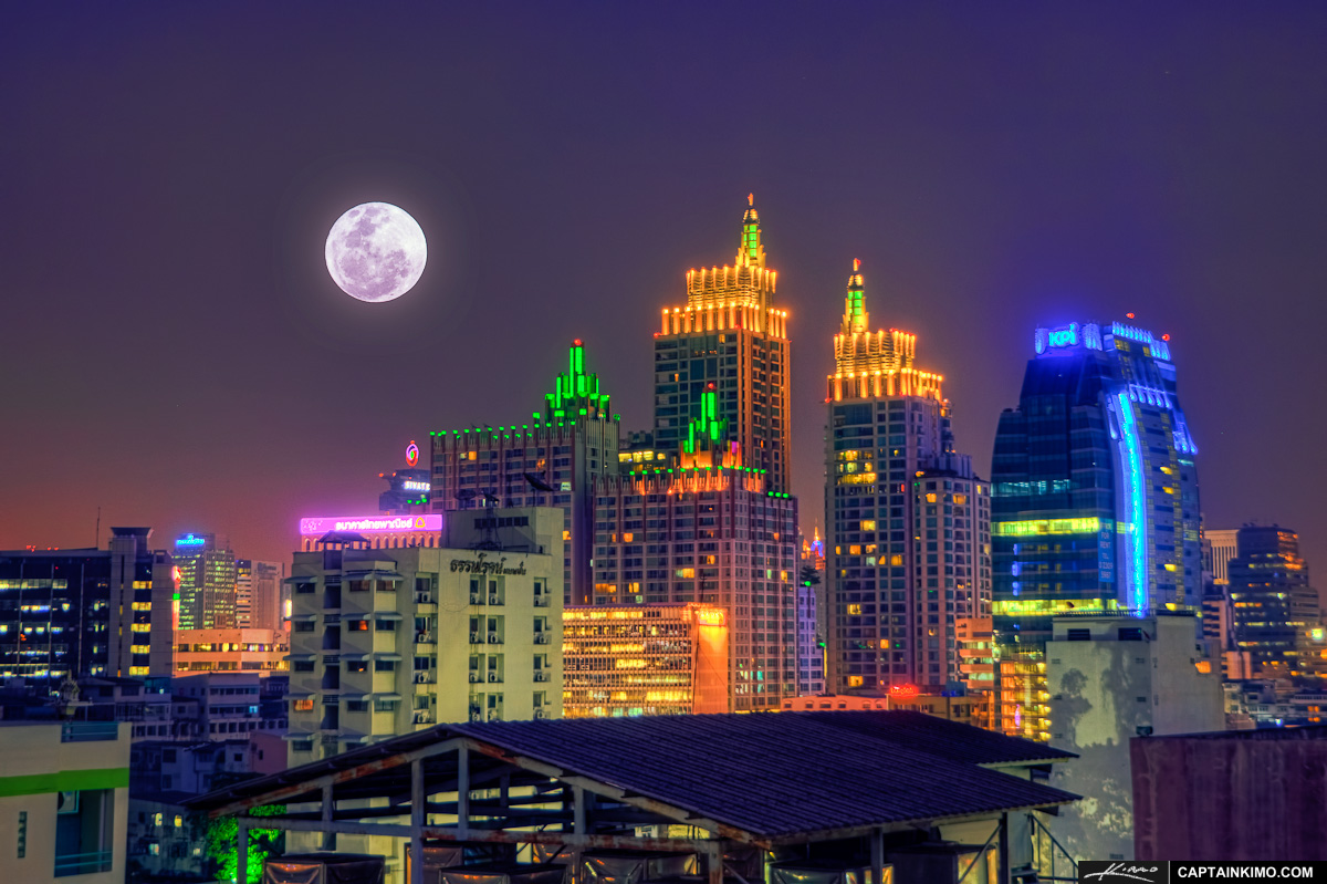 Full Moon Rise Over Roof Top in Bangkok Thailand