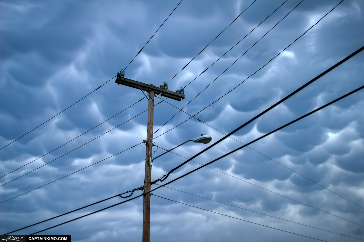 Telephone Pole and Electric Powerlines with Cloudy Storm Sky