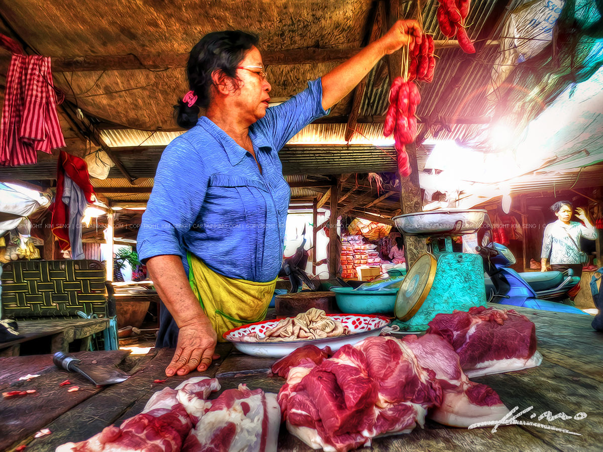 Getting Some Pork at the Market in Cambodia