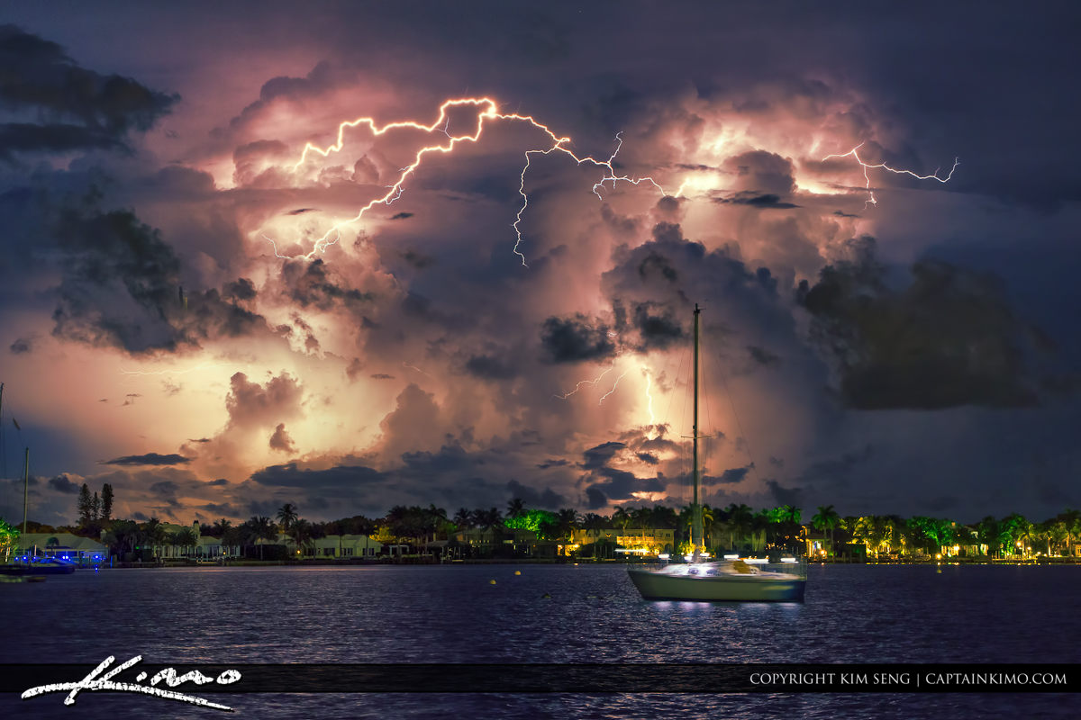 Sailboat with Bolts of Lightning Burst through Clouds