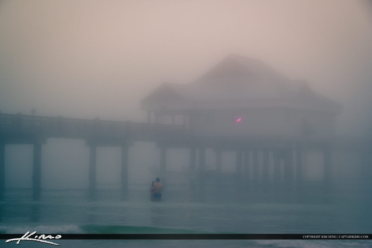Couples in the Foggy Water at Clearwater Pier Pinellas County Fl